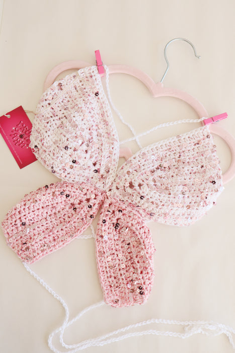 Haut papillon rose